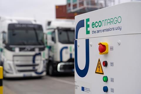 The image shows a Contargo e-truck charging facility