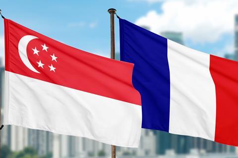 Picture shows the French and Singaporean flag flying at the port
