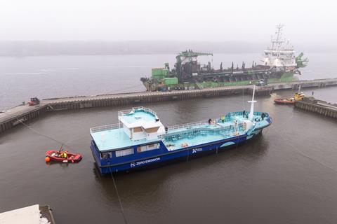 The image shows Lithuania's first electric/green hydrogen powered port tanker