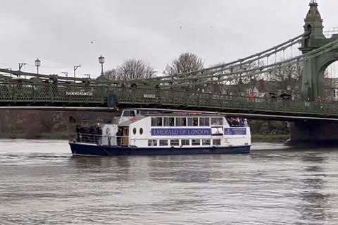 Emerald of London pleasure boat stuck under Hammersmith Bridge on the River Thames